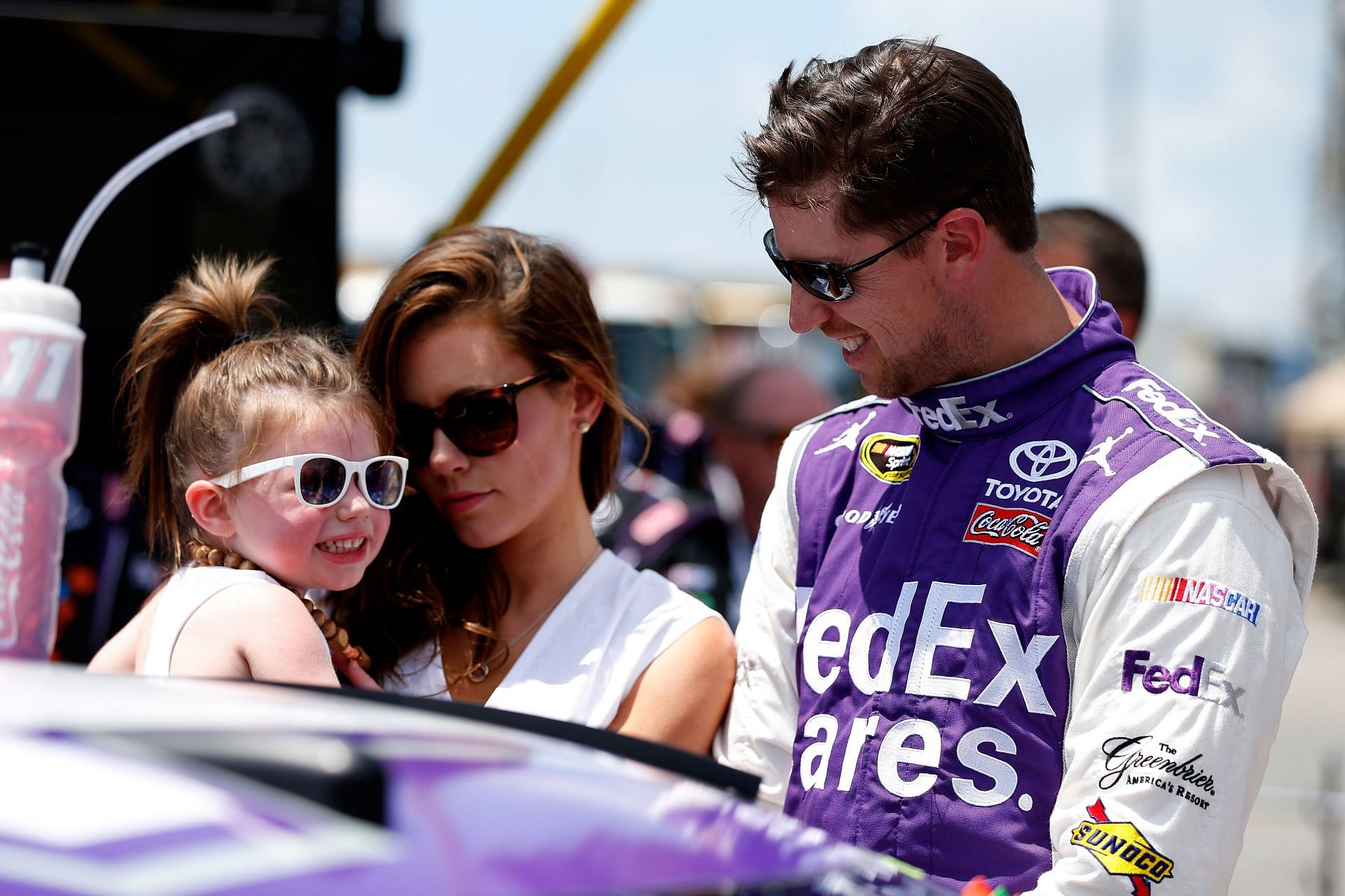Denny Hamlin with Jordan Fish and daughter Taylor James Hamlin at Dover in 2015. Source: Getty